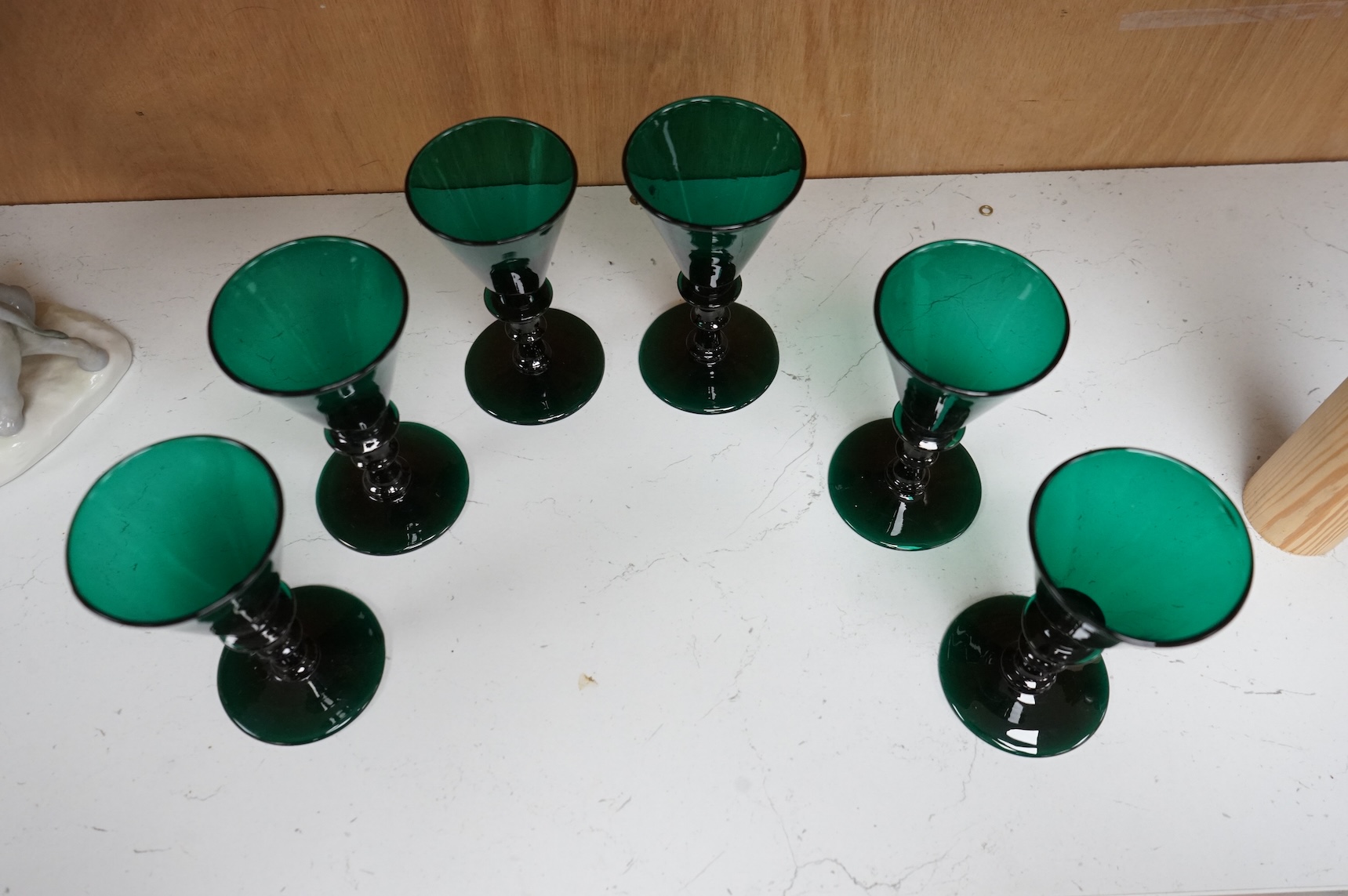 A late Georgian set of six green glasses, 13cm high